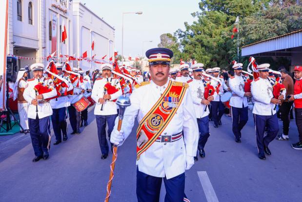 <p><em><strong>Bahrain Police Band parade to celebrate the 54th National Day near Isa Town Sports Club</strong></em></p><div class="explain-selected-button explain-selected-circle"></div><style>
.explain-selected-button.explain-selected-text-selected-show-button {
  display: block !important;
}

.explain-selected-button.explain-selected-expanded {
  width: 400px;
  border: 0px;
  cursor: default; 
  height: 350px; 
  overflow: auto;
  box-shadow: rgba(15, 15, 15, 0.05) 0px 0px 0px 1px, rgba(15, 15, 15, 0.1) 0px 3px 6px, rgba(15, 15, 15, 0.2) 0px 9px 24px;
}

.explain-selected-button.explain-selected-circle:not(.explain-selected-expanded) {
  width: 35px;
  height: 35px;
  background: transparent;
  border-radius: 50%;
  opacity: 0.5;
}
.explain-selected-button.explain-selected-circle:not(.explain-selected-expanded):hover::before {
  content: "";
  position: absolute;
  width: 35px;
  height: 35px;
  background-color: rgba(128, 0, 128, 0.5);
  border-radius: 50%;
  top: 50%;
  left: 50%;
  transform: translate(-50%, -50%);
  animation: explain-selected-growAndFade 2.0s ease-in-out;
  animation-iteration-count: infinite;
}

.explain-selected-button.explain-selected-circle:not(.explain-selected-expanded)::after {
  content: "";
  position: absolute;
  width: 10px;
  height: 10px;
  background-color: rgb(128, 0, 128);
  top: 50%;
  left: 50%;
  transform: translate(-50%, -50%);
  border-radius: 50%;
}
.explain-selected-button.explain-selected-circle:not(.explain-selected-expanded):hover::after {
  width: 14px;
  height: 14px;
}

@keyframes explain-selected-growAndFade {
  0% {
    width: 10px;
    height: 10px;
    opacity: 1;
  }
  100% {
    width: 30px;
    height: 30px;
    opacity: 0;
  }
}

.explain-selected-button {
  display: none !important;
  width: 120px;
  height: 28px;
  border-radius: 4px;
  border: 0px;
  position: absolute;
  z-index: 9999;
  opacity: 1;
  cursor: pointer;
  background: white;
  text-align:left;
  font-family: Tahoma,Arial,Helvetica Neue,Helvetica,sans-serif; 
  background-color: #fff;
  color: #333;
}

.swal2-icon-show-explainselected {
  border: none;
}

.swal2-container p {
  margin: 0 !important;
}

</style>